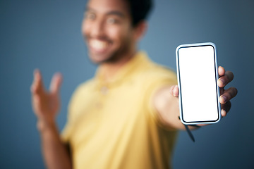 Image showing Phone screen, mockup and man hands in studio for advertising website, digital branding and deal coming soon. Closeup male model, smartphone and mock up space for promotion, placeholder and mobile app