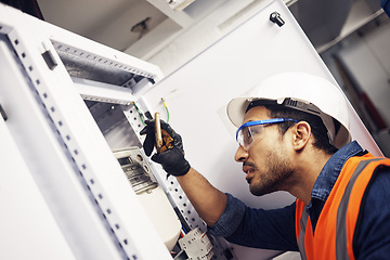 Image showing Electrician, engineer and maintenance man with screwdriver in control room for power box. Male technician person for inspection service for engineering, electricity or energy supply repair with torch