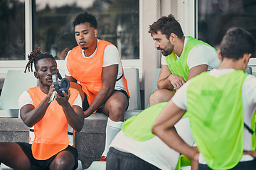 Image showing Men, relax or rugby team with headphones on break, exercise workout or training for a game. Music, friends relaxing or sports people bonding, talking or resting after practice match on bench together