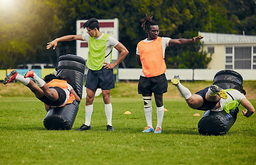 Image showing Rugby, tackle and men training on field with equipment ready for match, practice and sport games. Fitness, teamwork and male athletes for warm up performance, exercise and workout for competition