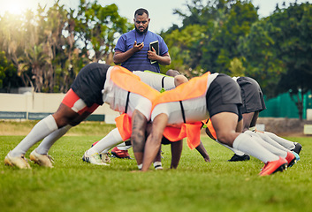 Image showing Rugby, sports and men in scrum for training on grass field ready for match, practice and sport game. Fitness, performance and team with coach tackle for warm up, exercise and workout for tournament