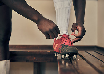 Image showing Rugby, tie shoes or hands of man ready to start playing a training game for exercise or workout. Zoom, fitness or Healthy athlete player with footwear or boots in changing room or sports club bench