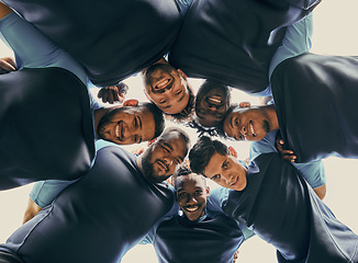 Image showing Low angle, fitness or rugby team in huddle with support or solidarity for competition, training game. Men group, happy smile or athletes in sports match or exercise together with pride or mission