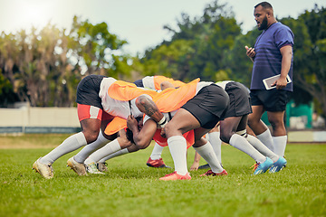 Image showing Rugby, scrum or men training with coach on grass field ready for match, practice or sports game. Fitness, performance or strong athletes in tackle for warm up, exercise and workout for a competition