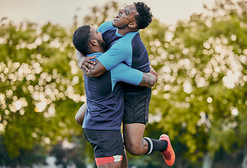 Image showing Rugby men, hug and celebration at game for winning, teamwork and success on field for sports. Team building, jumping and support for sport friends, goals and winner to celebrate achievement together