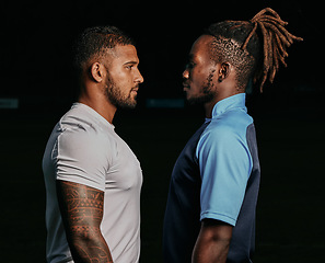 Image showing Profile, rival and a sports black man facing his opponent while looking serious in studio on a dark background. Face, challenge or conflict with a male athlete and competitor ready for competition