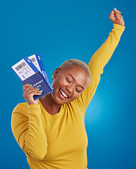 Image showing Excited, travel passport and black woman in studio on blue background with flight documents, tickets and ID. Traveling mockup, happy and girl celebrate immigration, holiday and international vacation