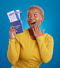 Image showing Surprise, travel passport and black woman in studio on blue background with flight documents, tickets and ID. Traveling mockup, happy and girl celebrate immigration, USA holiday and global vacation