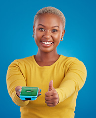 Image showing Phone screen, payment and woman thumbs up for transaction success in e commerce, online shopping and mobile app. Yes, like and thank you sign of black person, machine and fintech check mark in studio