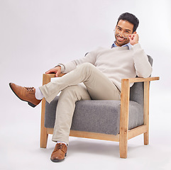 Image showing Portrait, chair and a man therapist sitting in a studio on a gray background ready to listen during counselling. Therapy, consulting and health with a male psychologist working in rehabilitation