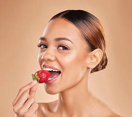 Image showing Skincare portrait, eating or woman with strawberry in studio on beige background for healthy nutrition or clean diet. Healthcare, face or beautiful girl model or marketing natural fruits for wellness