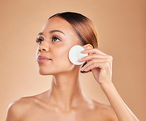 Image showing Beauty, cotton and cleaning face of woman in studio with dermatology, cosmetic and detox. Aesthetic model with hands for natural facial makeup clean, self care and skincare for glow or wellness