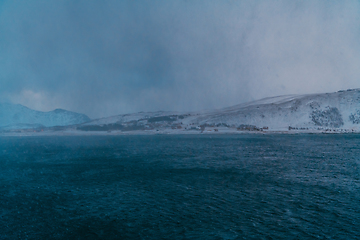 Image showing Norway coast in winter with snow bad cloudy weather