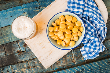 Image showing Tasty lupins and glass of beer