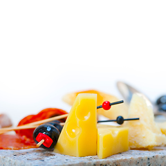 Image showing mix cold cut on a stone with fresh pears