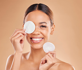 Image showing Face, cotton pad and woman with skincare, cosmetics and glow against a brown studio background. Portrait, female and lady with makeup remover, foundation and organic facial with grooming or soft skin