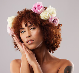 Image showing Portrait, skincare and flowers with a model woman in studio on a gray background for natural beauty. Wellness, luxury and face with an attractive young female wearing a flower crown or wreath