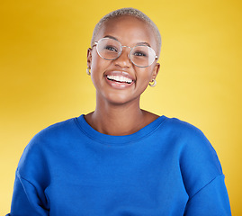 Image showing Young black woman, studio portrait and smile with glasses, eye health or fashion frame by yellow background. African, student girl or model for happiness, youth or beauty with eyes, vision and happy