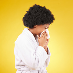 Image showing Sick black woman, tissue and blowing nose with afro and morning gown against a studio background. Isolated African American female with cold, flu or symptoms for illness, covid or fever on mockup