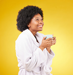 Image showing Happy, coffee and relaxed black woman in studio, waking up and smile on yellow background space. Carefree, relax and female with tea in bathrobe, satisfied and cheerful, stress relief and isolated