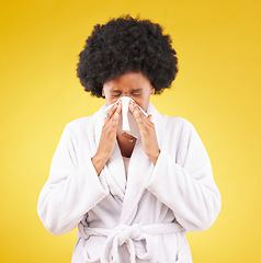 Image showing Black woman, afro and sick blowing nose with tissue and morning gown against a studio background. Isolated African American female with cold, flu or symptoms for illness, covid or fever on mockup