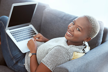 Image showing Happy black woman, portrait and sofa with laptop mockup to search social media, online shopping or download. Female relax on couch with computer technology, mock up and internet blogging with smile