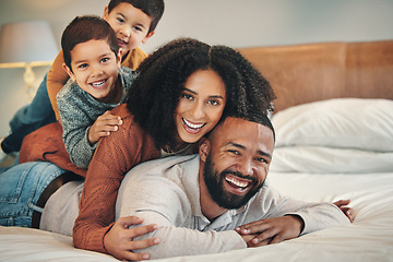 Image showing Laughing, family and portrait smile on bed in bedroom, bonding and care in home. Love, comedy and happy mother, comic father and funny children playing, having fun and enjoying quality time together.