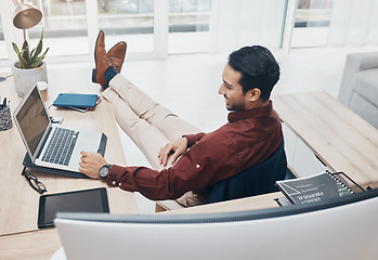 Image showing Working from home man with feet up on desk reading news on laptop with job confidence, productivity and online career. Remote worker, entrepreneur or professional person relax and smiling on computer