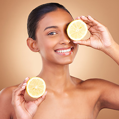 Image showing Skincare smile, woman portrait and lemon for health, wellness and beauty of a young model with happiness. Studio and healthy fruit with vitamin c and fruits nutrition for facial and dermatology