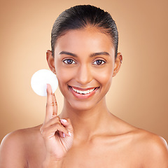 Image showing Beauty, skincare and cotton with portrait of indian woman in studio for self care, makeup remover and cosmetics. Happy, clean and glow with model on brown background for results, natural and facial