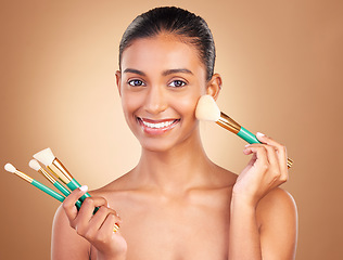 Image showing Cosmetic brushes, portrait and woman with natural beauty, wellness and happiness from cosmetics. Facial skin glow, happy and makeup artist brush of a young female model with self care in a studio