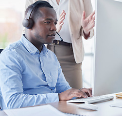 Image showing Black man, call center and coach by computer for training in telemarketing, customer service or support at office. African American male intern consultant working on desktop PC with mentor in sales