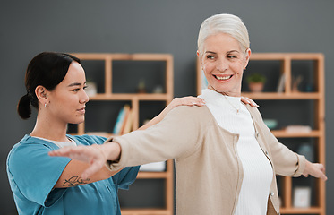 Image showing Physiotherapy, senior woman and shoulder massage of a Asian physiotherapist and rehabilitation. Physical therapy, retirement and elderly patient with happiness from arm adjustment and stretching