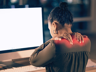 Image showing Woman, back pain and computer mockup screen in stress, burnout or overworked at night by office desk. Businesswoman touching painful shoulders by desktop PC with copy space display at workplace