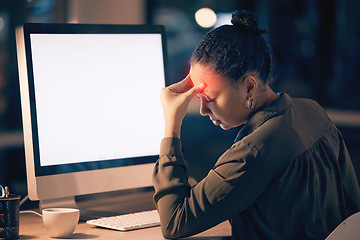 Image showing Woman, headache and computer mockup screen in stress, burnout or suffering pain at night by office desk. Businesswoman touching painful head by desktop PC with copy space display at workplace