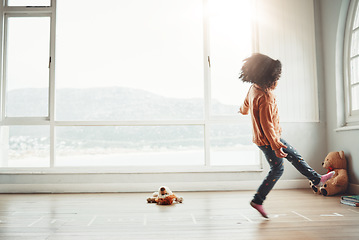 Image showing Hopscotch, happy and girl play in home having fun, enjoying games and relaxing in bedroom. Childhood mockup, entertainment and girl with copy space playing, jumping and balance for numbers activity