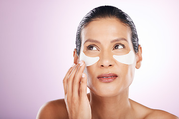 Image showing Face, skincare and woman eye patches in studio isolated on a purple background. Thinking, dermatology and serious female model with facial mask or cosmetics pads for healthy skin, collagen and beauty