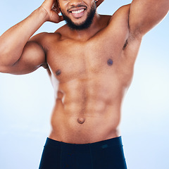 Image showing Black man, fitness and body, smile and abs, healthy and active with muscle and strong on blue background. Shirtless male, exercise and bodybuilder with bare abdomen, workout and wellness in studio