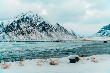 Image showing Norway coast in winter with snow bad cloudy weather