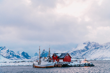 Image showing Traditional Norwegian fisherman's cabins and boats