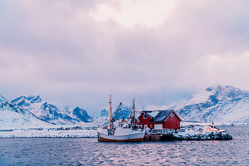 Image showing Traditional Norwegian fisherman's cabins and boats