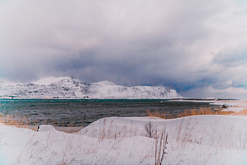 Image showing Norway coast in winter with snow bad cloudy weather