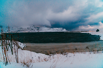 Image showing Norway coast in winter with snow bad cloudy weather