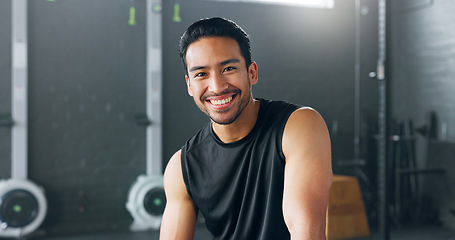 Image showing Fitness, exercise and laughing with a man in a gym for a workout or training to get strong or healthy. Wellness, smile and portrait with a happy young male athlete in a health club for exercising