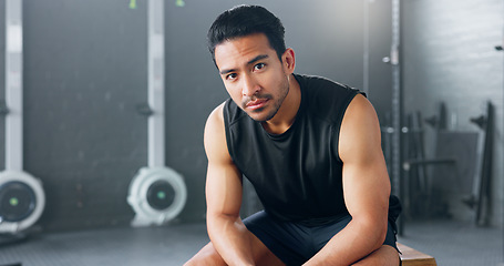 Image showing Gym, sports man and fitness training by man serious about health, wellness and competitive mindset. Face, portrait and asian instructor sitting before workout, exercise and cardio exercises in Japan