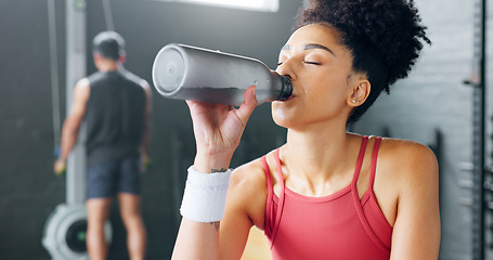 Image showing Water, tired and woman thinking after fitness, training and exercise for body motivation at the gym. Drink, bottle and face of a young girl at a club for wellness, workout and cardio with an idea