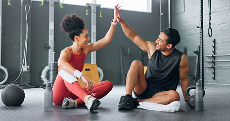 Image showing High five woman, personal trainer man for fitness goal in gym or training facility together. Success, black woman motivation or friends at wellness workout, exercise support or partnership for health
