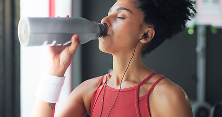 Image showing Water, tired and woman thinking after fitness, training and exercise for body motivation at the gym. Drink, bottle and face of a young girl at a club for wellness, workout and cardio with an idea