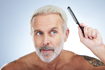 Image showing Hair style, comb and grooming with man in studio for haircare, barber and morning routine. Beauty, hairdresser and salon with senior male on white background for handsome, self care and brushing