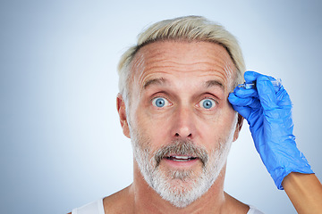 Image showing Botox, portrait and surprise of a senior man in a studio doing plastic surgery and cosmetic skincare. Dermatology, wrinkles and anti aging treatment of a mature model with silicone filler injection